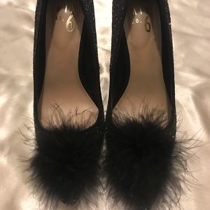 Black sparkly heels with feathers